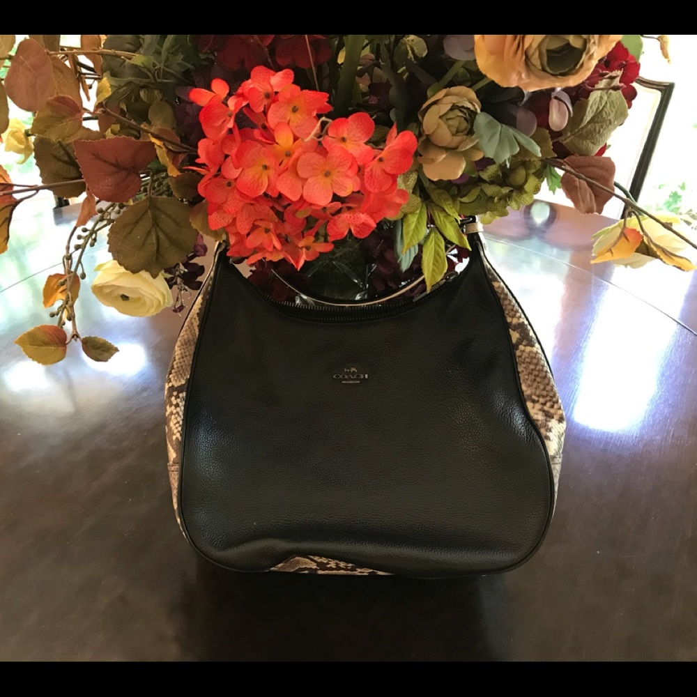 Coach black Hobo bag with snake skin accent.
